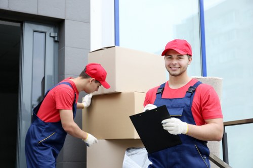 Man with van moving boxes in a Seven Kings residential street