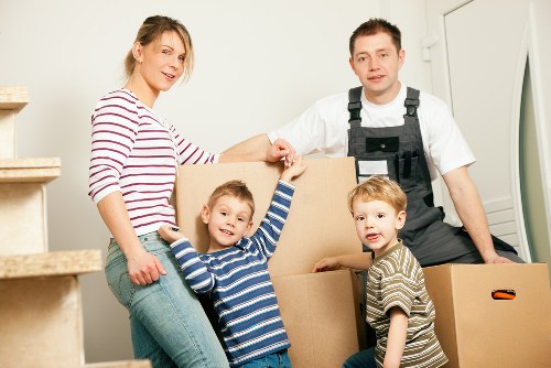 Removal van and movers handling furniture near Seven Kings homes