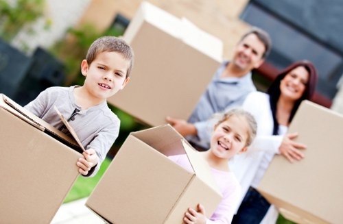 Moving team handling packed boxes for a Seven Kings relocation