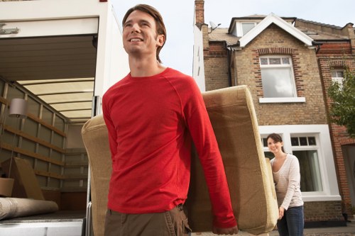 Movers carefully loading furniture for a local Seven Kings relocation