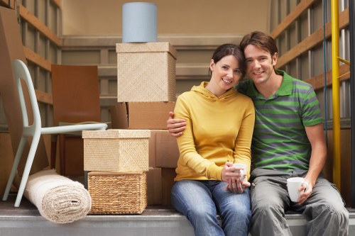 Professional movers handling office equipment near Seven Kings