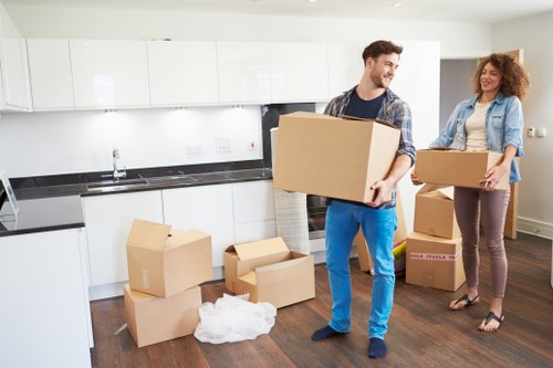 Moving team loading boxes and household items in Seven Kings