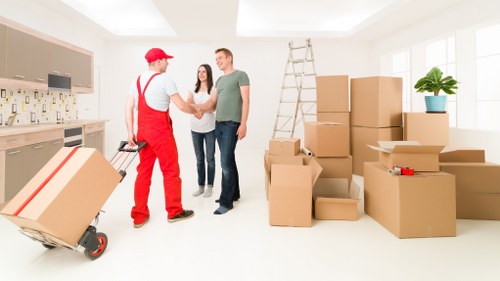Supervisor reviewing site safety before a moving task begins