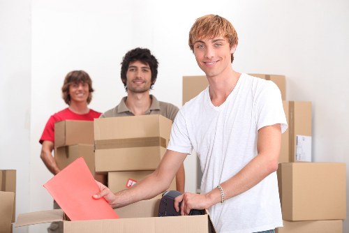 Mover using PPE while handling furniture in Seven Kings