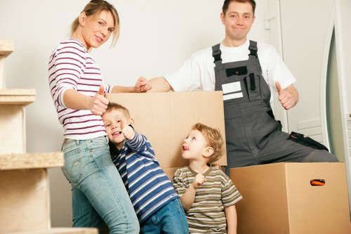 Local moving team handling furniture loading into a van